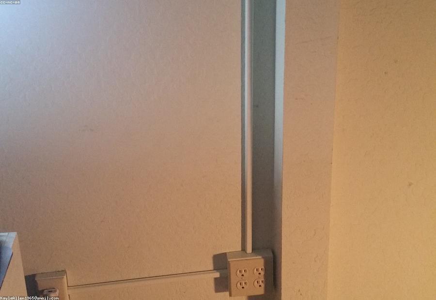 Electrician evaluating wiring capacity in an older North Texas home