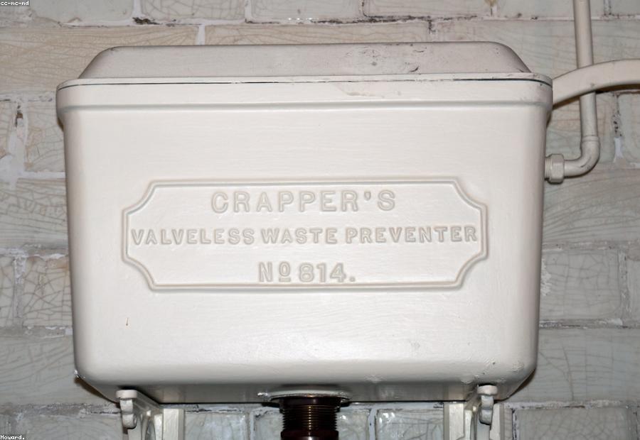 Inside of a toilet tank showing the flapper and fill valve — the usual suspects in a running toilet