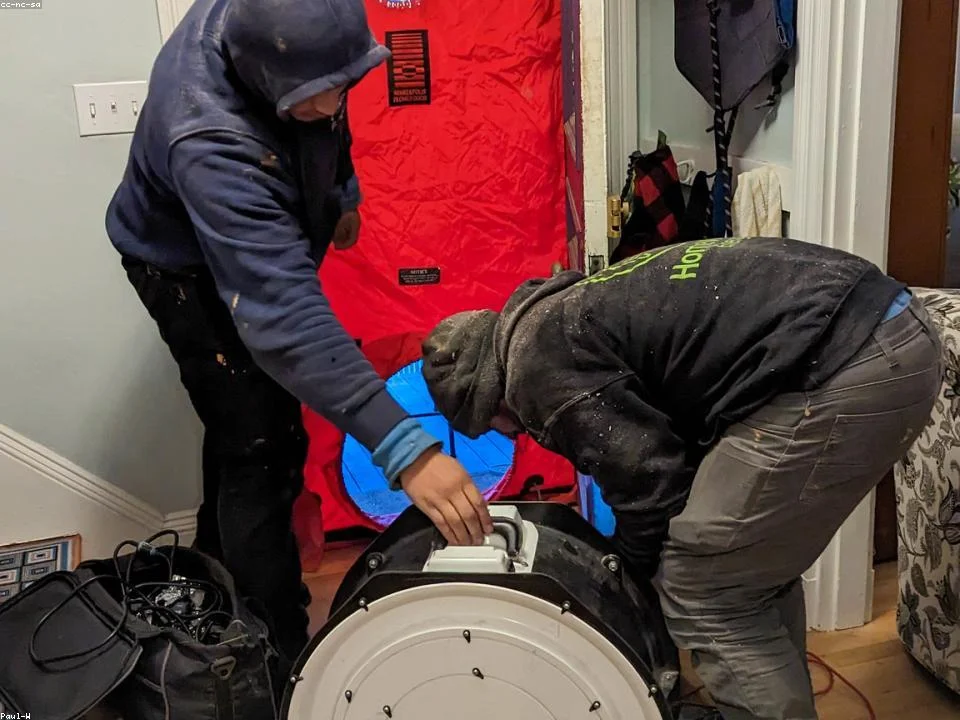 Fresh blown-in insulation being installed to R-38 depth in a North Texas attic