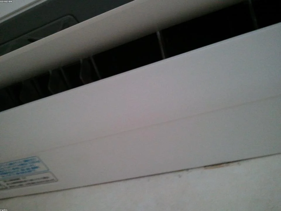 New high-efficiency AC condenser being installed at a DFW home