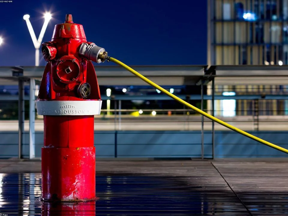 Water spraying from a burst copper supply pipe before emergency shut-off